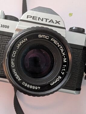 Pentax Silver and Black SLR Camera with 50mm Lens